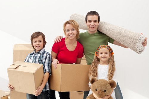 Professional movers handling desks and IT equipment during office removals