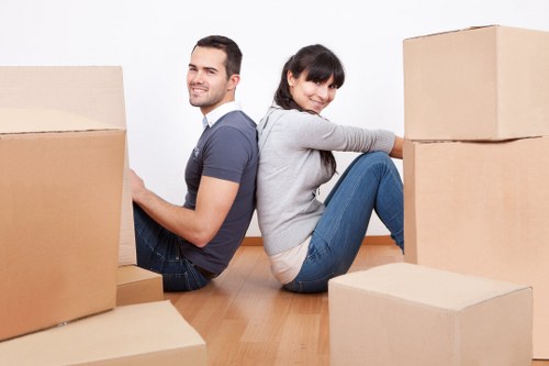 Professional movers handling a few items during a small removal in Becontreeheath